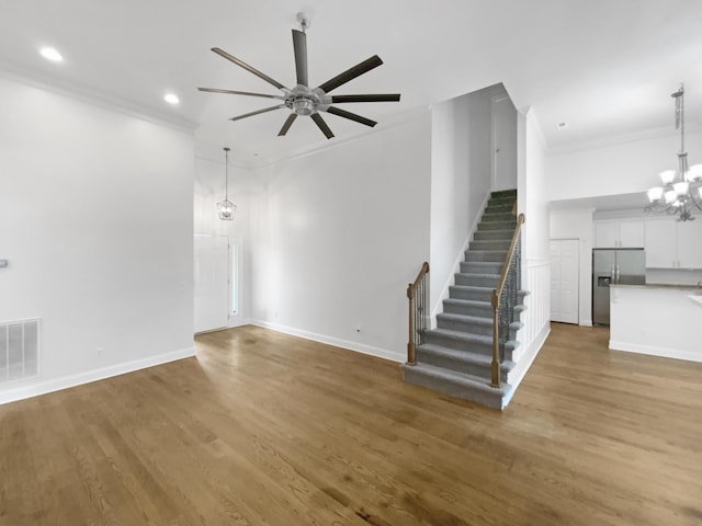 1783 Andover Pl, Chattanooga, TN 37421 - unfurnished living room with ornamental molding, stairway, recessed lighting, wood finished floors, and a ceiling fan