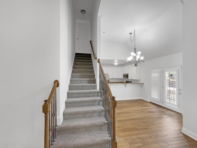 1783 Andover Pl, Chattanooga, TN 37421 - stairs featuring wood finished floors, a chandelier, and crown molding