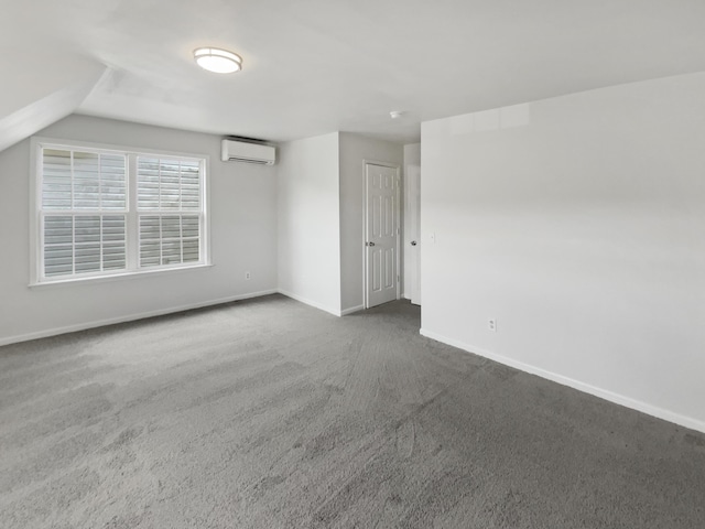 1783 Andover Pl, Chattanooga, TN 37421 - empty room featuring an AC wall unit, dark colored carpet, and lofted ceiling