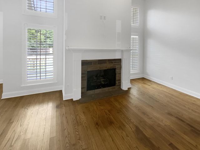 1783 Andover Pl, Chattanooga, TN 37421 - unfurnished living room with wood finished floors, a fireplace with flush hearth, and a high ceiling