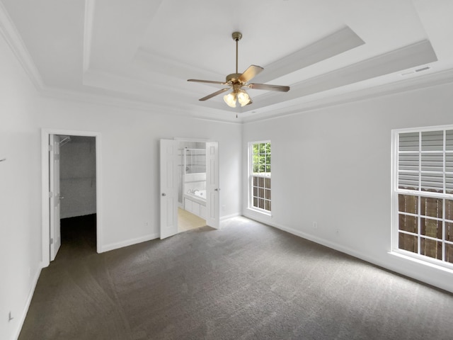 1783 Andover Pl, Chattanooga, TN 37421 - unfurnished bedroom featuring a tray ceiling, carpet flooring, a walk in closet, ornamental molding, and a ceiling fan