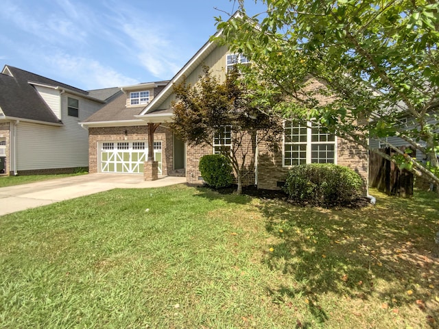 1783 Andover Pl, Chattanooga, TN 37421 - view of front of property featuring a front lawn, concrete driveway, an attached garage, and brick siding