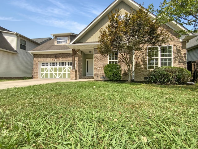 1783 Andover Pl, Chattanooga, TN 37421 - view of front of house featuring an attached garage, driveway, a front lawn, and brick siding