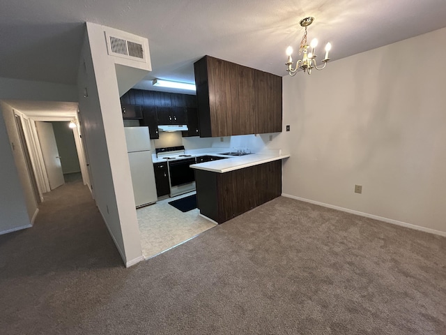 900 Mountain Creek Rd Unit C38, Chattanooga, TN 37405 - kitchen with white appliances, light colored carpet, a chandelier, and light countertops