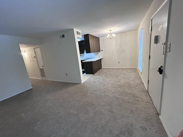 900 Mountain Creek Rd Unit C38, Chattanooga, TN 37405 - unfurnished living room featuring a chandelier and carpet flooring
