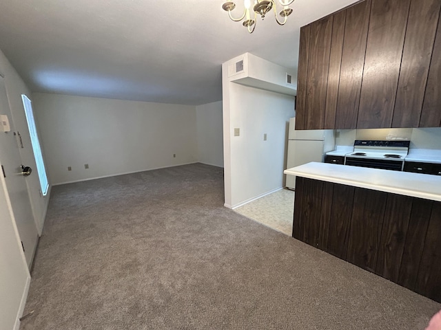 900 Mountain Creek Rd Unit C38, Chattanooga, TN 37405 - kitchen featuring white appliances, light carpet, dark brown cabinetry, a chandelier, and light countertops