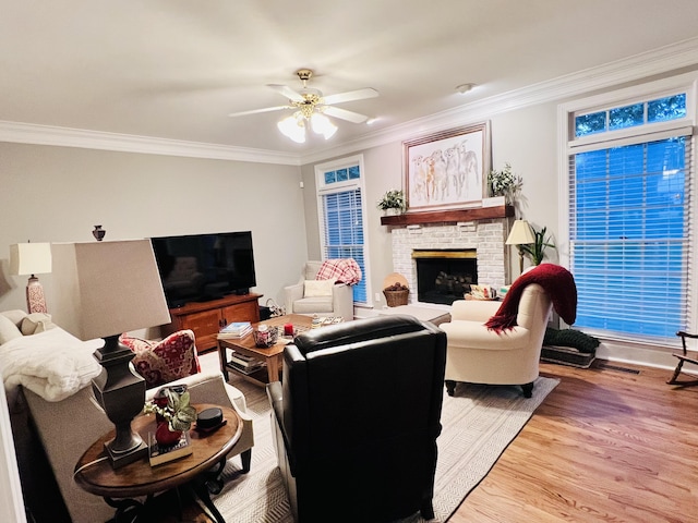 8712 Brow Lake Rd, Soddy Daisy, TN 37379 - living room featuring wood finished floors, ornamental molding, ceiling fan, and a brick fireplace