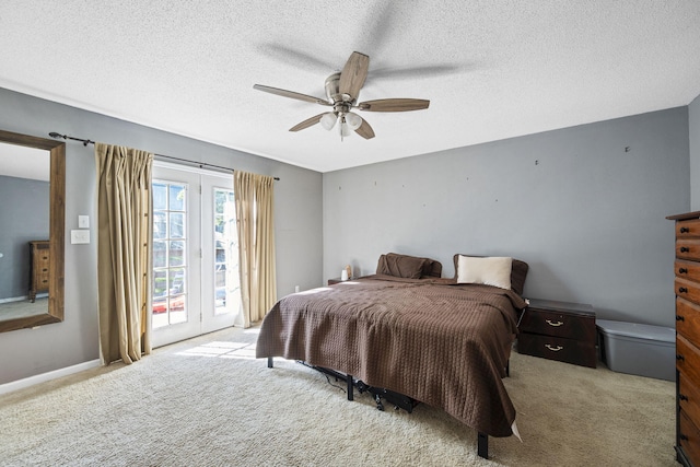 7700 Dune Ln, Hixson, TN 37343 - carpeted bedroom featuring access to exterior, a textured ceiling, and a ceiling fan