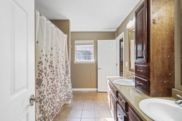 7700 Dune Ln, Hixson, TN 37343 - bathroom with tile patterned flooring, double vanity, a textured ceiling, and a shower with shower curtain