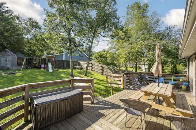7700 Dune Ln, Hixson, TN 37343 - wooden terrace with a storage shed, a fenced backyard, outdoor dining area, and a playground