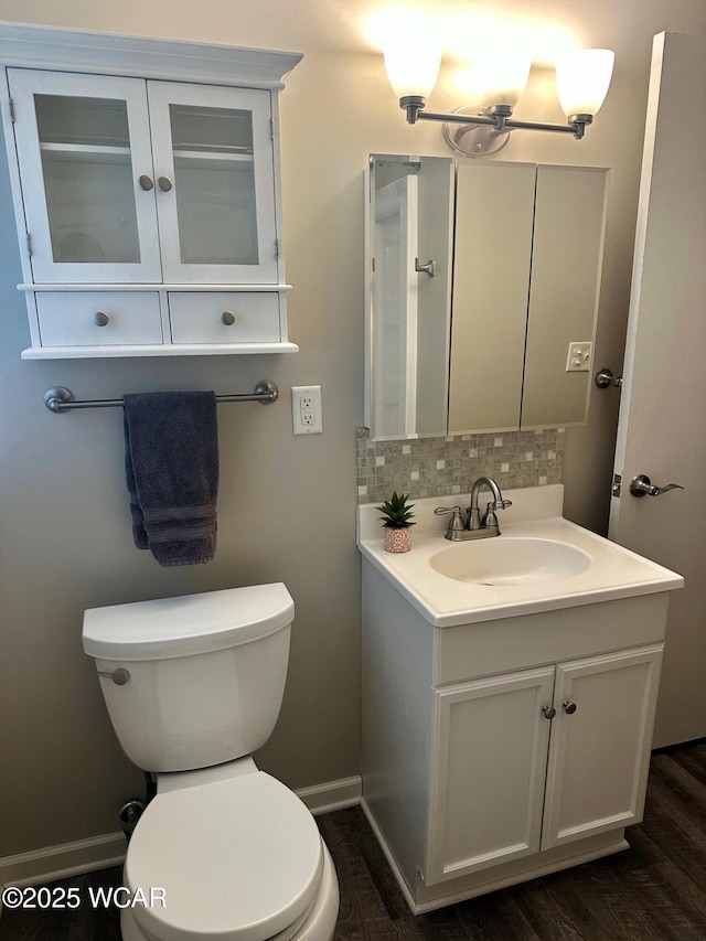 510 Rosewood Ave, Findlay, OH 45840 - bathroom with tasteful backsplash, wood finished floors, vanity, baseboards, and toilet