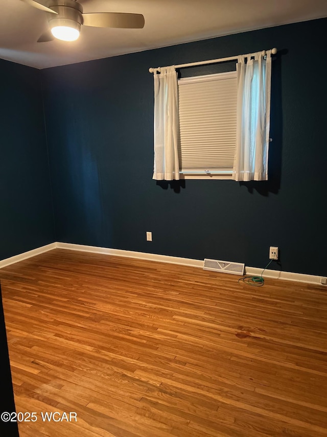 510 Rosewood Ave, Findlay, OH 45840 - spare room with baseboards, a ceiling fan, wood finished floors, and visible vents