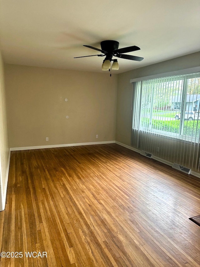 510 Rosewood Ave, Findlay, OH 45840 - spare room featuring ceiling fan, baseboards, visible vents, and wood finished floors