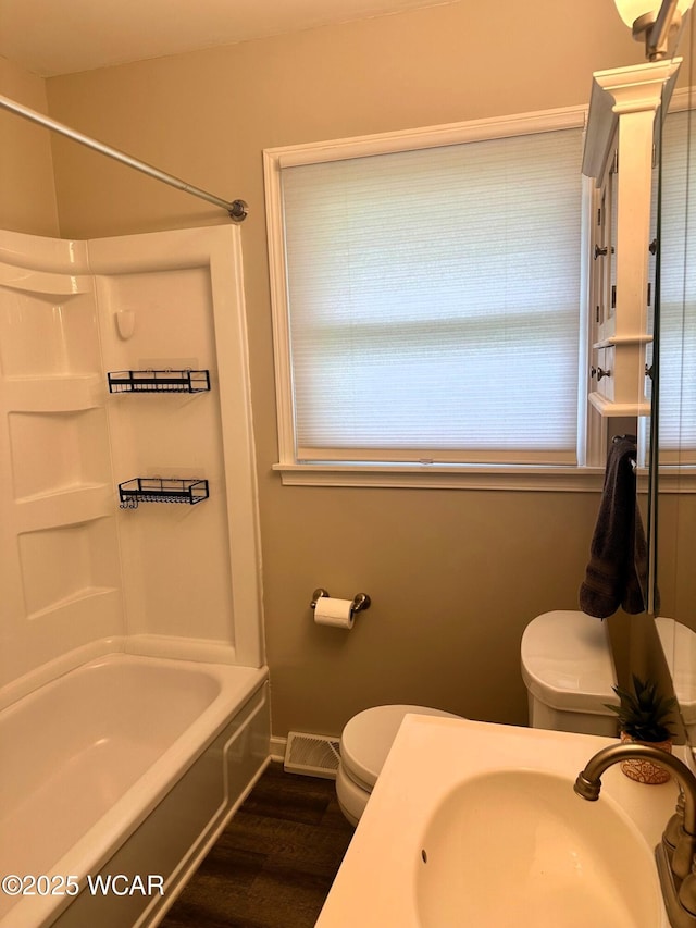 510 Rosewood Ave, Findlay, OH 45840 - full bath featuring  shower combination, a sink, wood finished floors, and toilet