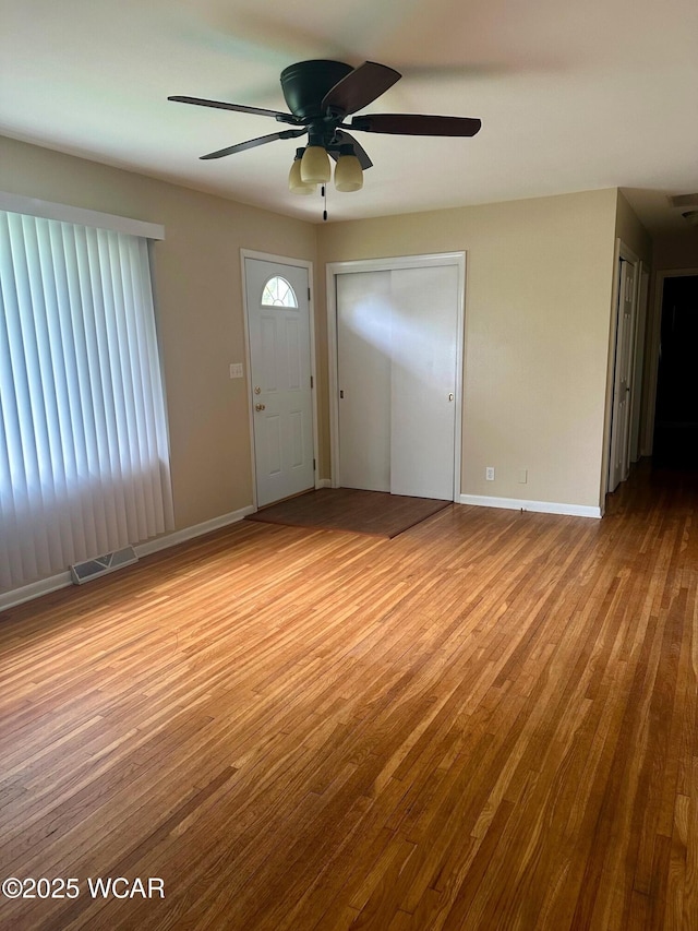 510 Rosewood Ave, Findlay, OH 45840 - interior space with baseboards, a ceiling fan, wood finished floors, and visible vents