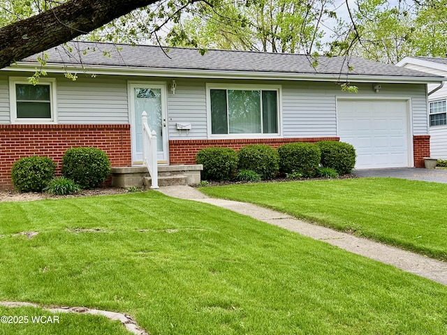 510 Rosewood Ave, Findlay, OH 45840 - single story home featuring aphalt driveway, a front yard, roof with shingles, brick siding, and an attached garage