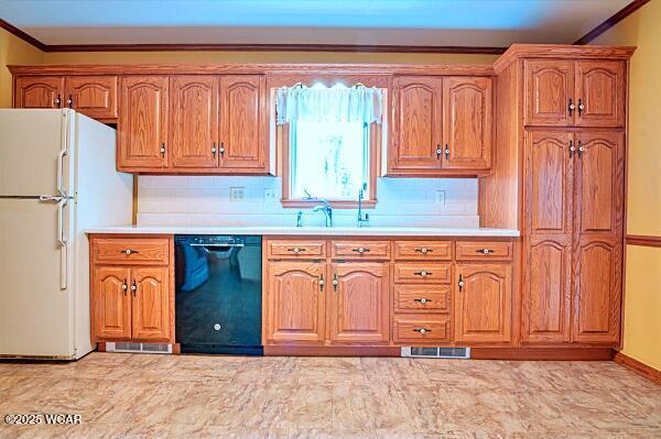 kitchen with decorative backsplash, ornamental molding, black dishwasher, and white fridge