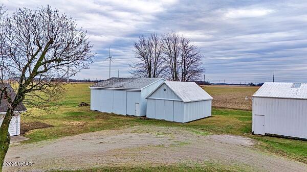 view of outdoor structure featuring a rural view