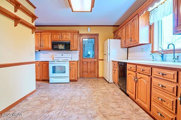 kitchen featuring sink and black appliances