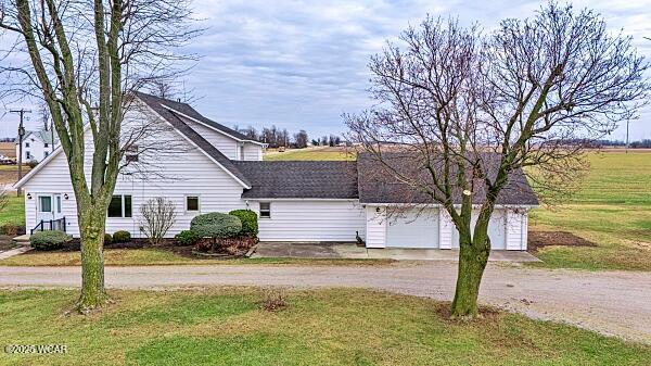 view of front facade with a garage and a front lawn