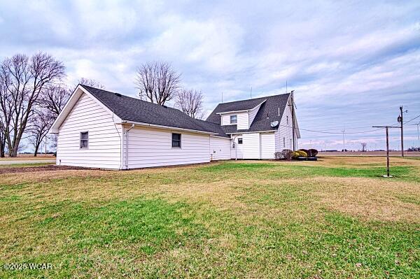 back of house with a yard