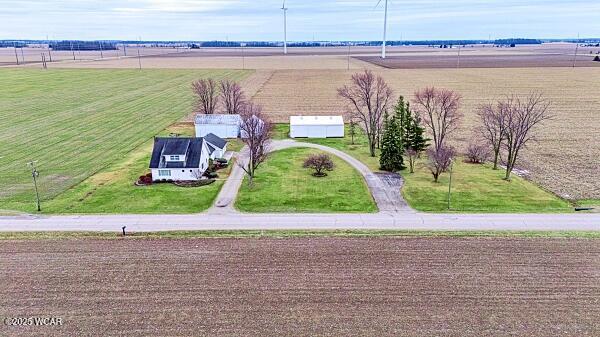 birds eye view of property featuring a rural view