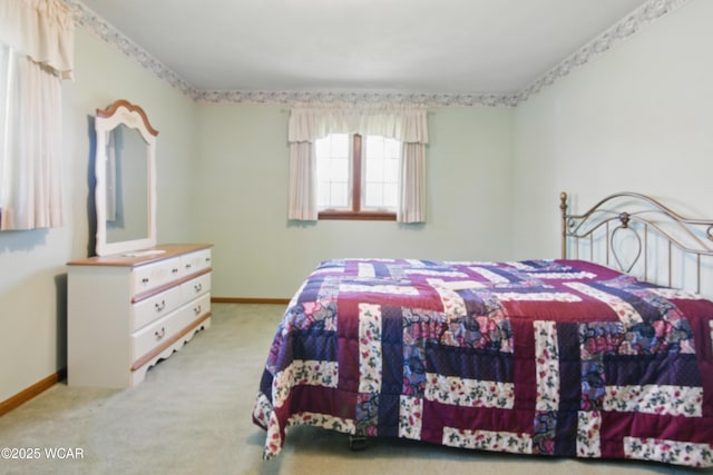 bedroom featuring baseboards and carpet floors