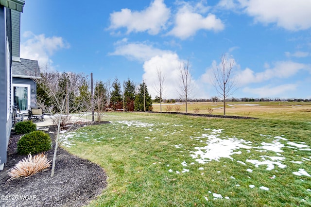 view of yard featuring a rural view and a patio area