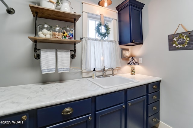 kitchen with blue cabinets and sink