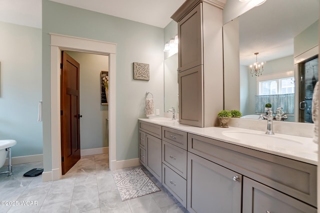 bathroom with vanity and a notable chandelier