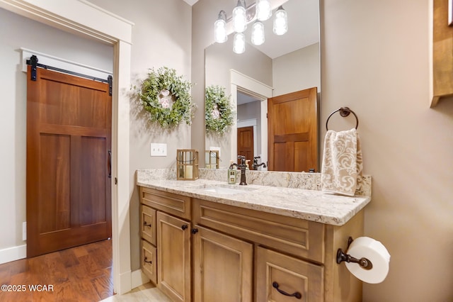 bathroom featuring vanity and hardwood / wood-style floors