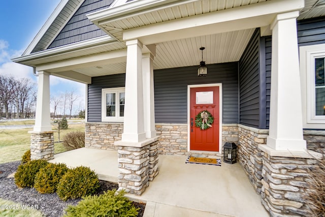 doorway to property with a porch