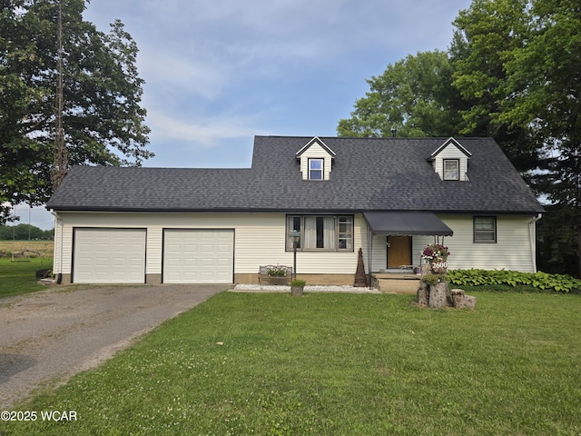 2600 Franks Dr, Lima, OH 45807 - new england style home featuring driveway, a garage, a front yard, and roof with shingles