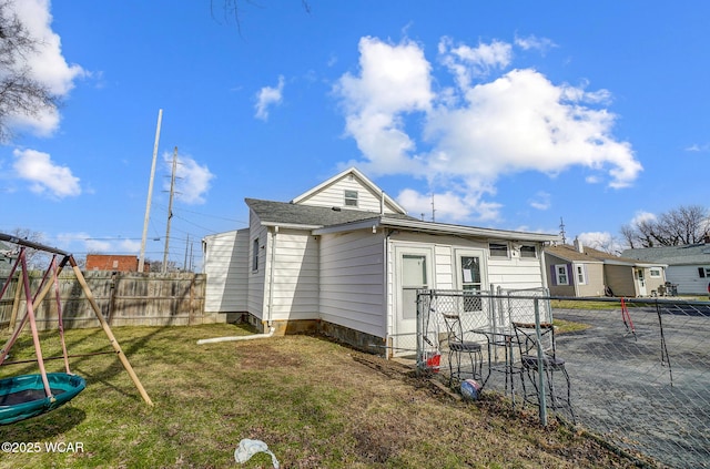 back of house with a yard