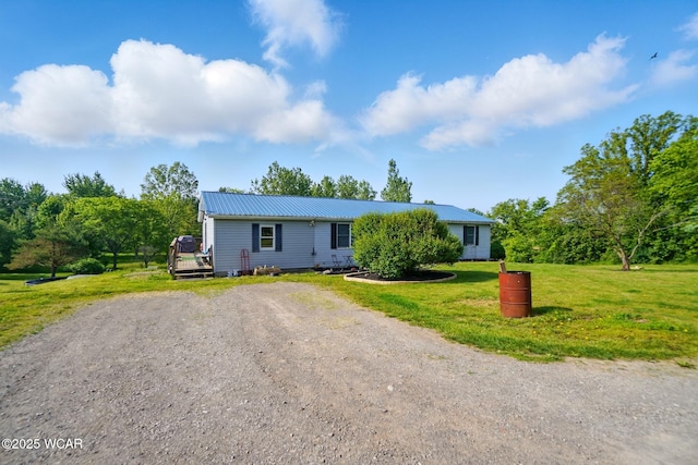 442 N Phillips Rd, Harrod, OH 45850 - single story home with dirt driveway, a front yard, and metal roof
