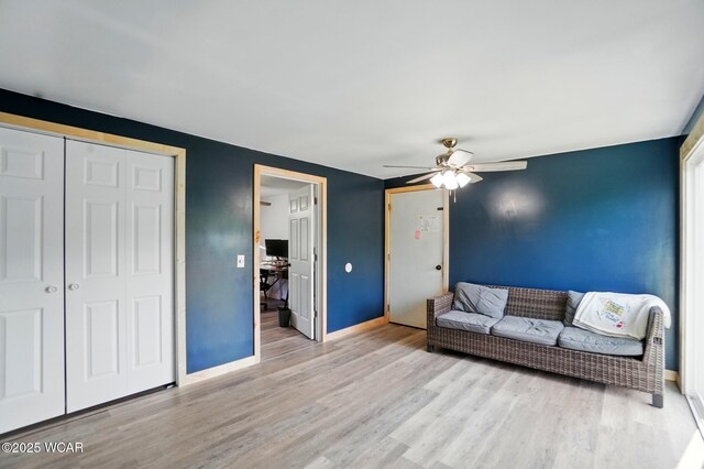 442 N Phillips Rd, Harrod, OH 45850 - living room featuring wood finished floors, ceiling fan, and baseboards