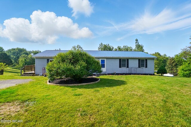 442 N Phillips Rd, Harrod, OH 45850 - view of front facade with a wooden deck, a front yard, and metal roof