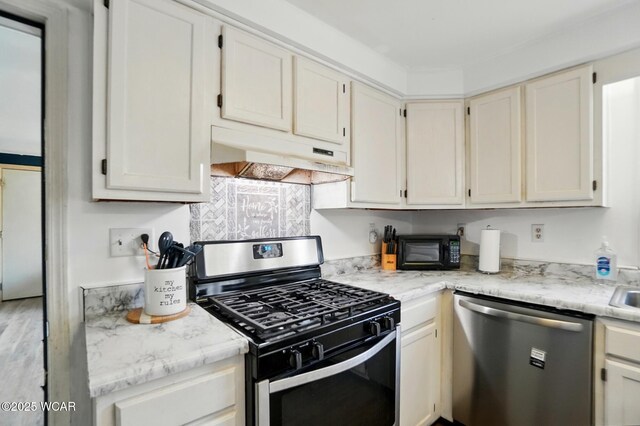 442 N Phillips Rd, Harrod, OH 45850 - kitchen with appliances with stainless steel finishes and under cabinet range hood