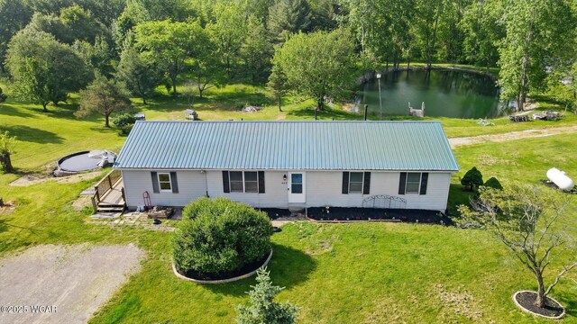 442 N Phillips Rd, Harrod, OH 45850 - view of front of home featuring a water view, metal roof, and a front lawn
