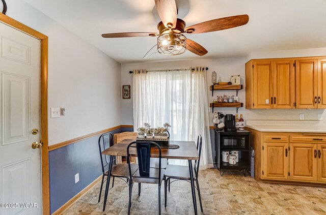 dining area with a ceiling fan