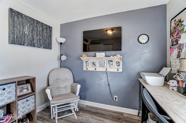 sitting room featuring wood finished floors and baseboards