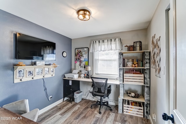 office area with baseboards and wood finished floors