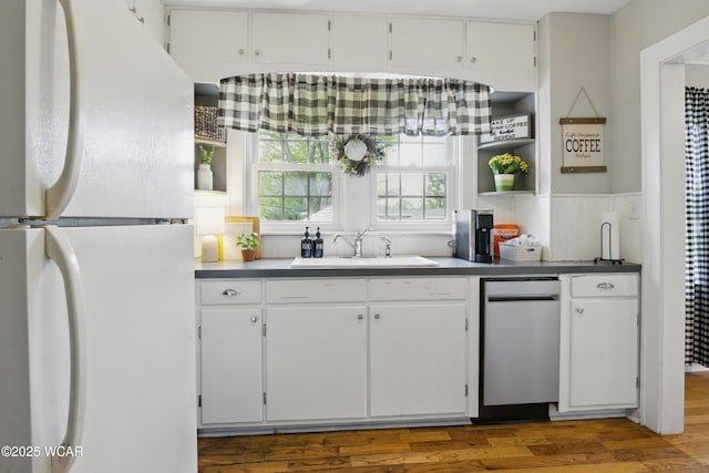 800 S Tyler St, Van Wert, OH 45891 - kitchen featuring freestanding refrigerator, a sink, white cabinets, wood finished floors, and open shelves
