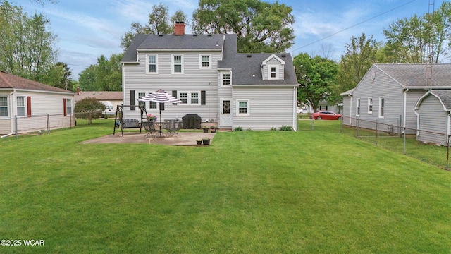 800 S Tyler St, Van Wert, OH 45891 - back of property with a chimney, a patio area, and roof with shingles