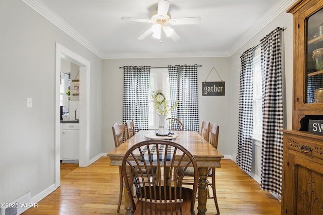 800 S Tyler St, Van Wert, OH 45891 - dining area with light wood-style flooring, a ceiling fan, ornamental molding, and baseboards