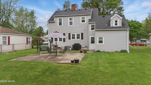 800 S Tyler St, Van Wert, OH 45891 - rear view of house featuring a chimney, a patio area, and a shingled roof