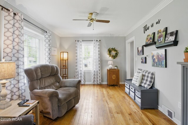 800 S Tyler St, Van Wert, OH 45891 - living area with a ceiling fan, light wood-type flooring, baseboards, and ornamental molding