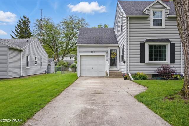 800 S Tyler St, Van Wert, OH 45891 - view of front of home featuring an attached garage, concrete driveway, and roof with shingles