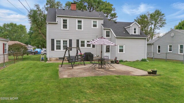 800 S Tyler St, Van Wert, OH 45891 - back of house with a chimney, a patio area, and roof with shingles