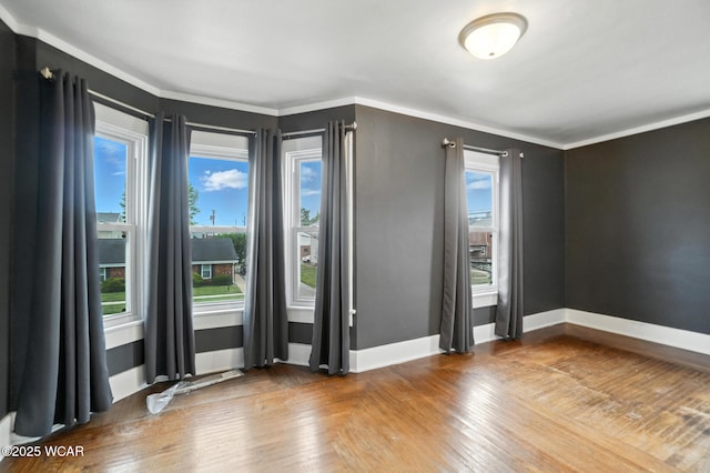210 N Pierce St, Delphos, OH 45833 - empty room with wood finished floors and ornamental molding